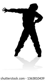 A male street dance hip hop dancer in silhouette
