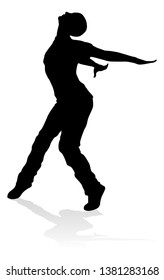 A male street dance hip hop dancer in silhouette