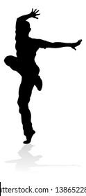 A male street dance hip hop dancer in silhouette