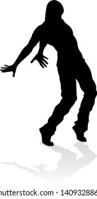 A male street dance hip hop dancer in silhouette
