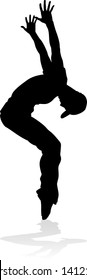 A male street dance hip hop dancer in silhouette