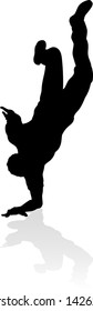 A male street dance hip hop dancer in silhouette