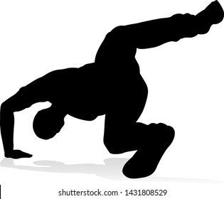 A male street dance hip hop dancer in silhouette