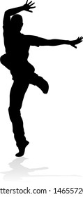 A male street dance hip hop dancer in silhouette