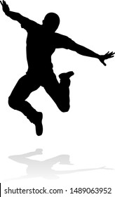 A male street dance hip hop dancer in silhouette