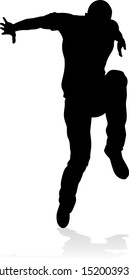 A male street dance hip hop dancer in silhouette