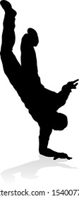 A male street dance hip hop dancer in silhouette