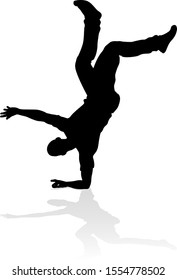 A male street dance hip hop dancer in silhouette