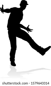 A male street dance hip hop dancer in silhouette