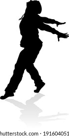 A male street dance hip hop dancer in silhouette