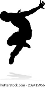 A male street dance hip hop dancer in silhouette