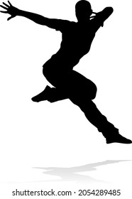 A male street dance hip hop dancer in silhouette