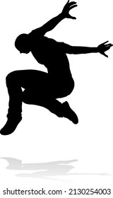 A male street dance hip hop dancer in silhouette