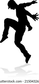 A male street dance hip hop dancer in silhouette