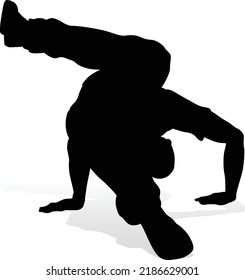 A male street dance hip hop dancer in silhouette