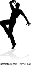 A male street dance hip hop dancer in silhouette