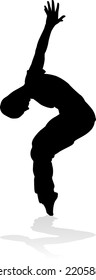 A male street dance hip hop dancer in silhouette