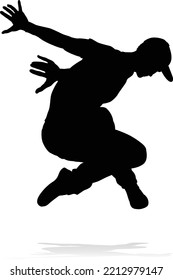 A male street dance hip hop dancer in silhouette