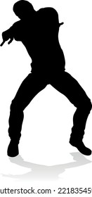 A male street dance hip hop dancer in silhouette
