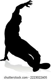 A male street dance hip hop dancer in silhouette