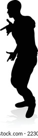 A male street dance hip hop dancer in silhouette