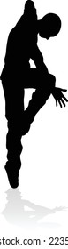 A male street dance hip hop dancer in silhouette