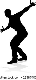 A male street dance hip hop dancer in silhouette