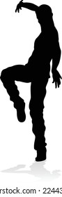 A male street dance hip hop dancer in silhouette