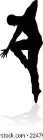 A male street dance hip hop dancer in silhouette