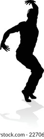 A male street dance hip hop dancer in silhouette