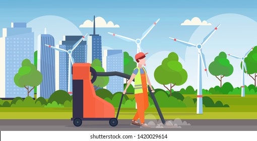 male street janitor holding industrial vacuum cleaner man vacuuming garbage streets cleaning service concept modern wind turbines cityscape background full length flat horizontal