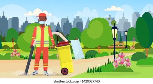 male street janitor holding professional vacuum cleaner african american man vacuuming garbage cleaning service concept urban park cityscape background full length flat horizontal