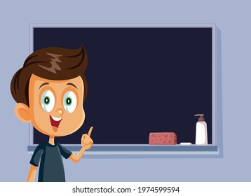 Male Student Standing in Front of a Blackboard. Happy schoolboy presenting his assignment in class for oral examination project
