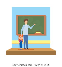 male teacher with girl in the classroom
