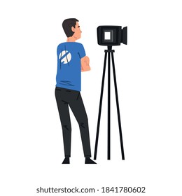 Male Video Operator Looking Through Professional Camcorder on Tripod, Television Industry Concept Cartoon Style Vector Illustration