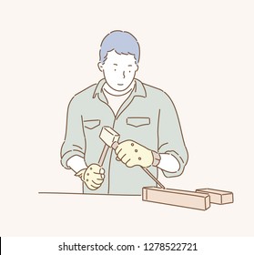 A male worker is doing woodworking. hand drawn style vector design illustrations.