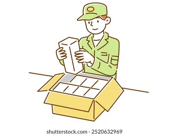 A male worker putting luggage into a cardboard box
