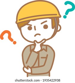 A male worker who puts his hand on his chin and thinks about something