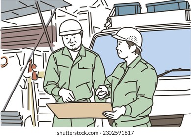 Male workers looking at drawings in front of a truck
