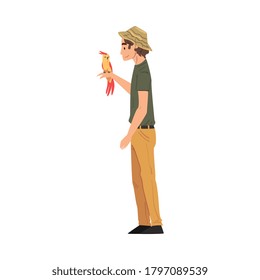 Male Zoo Worker with Parrot on his Hand, Veterinarian or Professional Zookeeper Character Caring of Wild Animals in Zoo Cartoon Vector Illustration