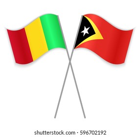 Malian and Timorese crossed flags. Mali combined with East Timor isolated on white. Language learning, international business or travel concept.