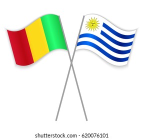 Malian and Uruguayan crossed flags. Mali combined with Uruguay isolated on white. Language learning, international business or travel concept.