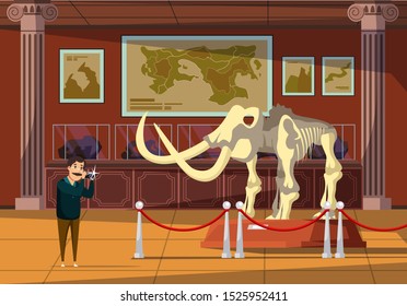 Mammoth bones exhibition flat vector illustration. Paleontology museum visitor cartoon character. Ice age, extinct animal, prehistoric elephant skeleton. Smiling tourist taking showpiece photo