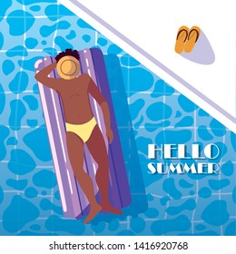 man afro tanning in float on the pool