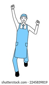 A man in an apron smiling and jumping.