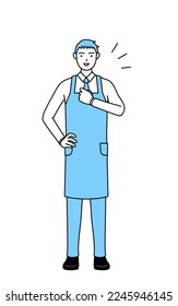 A man in an apron tapping his chest.