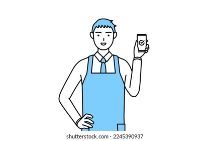 A man in an apron using a smartphone at work.