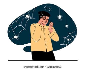 Man with arachnophobia. Young guy stands in horror among cobwebs with spiders. Psychological disorder and mental health. Scary and dark place. Hallucinations. Cartoon flat vector illustration