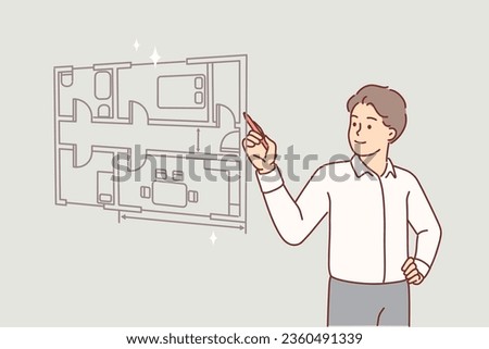 Man architect draws room plan of apartment on virtual screen, choosing place for furniture and interior items. Guy architect creates construction drawings for team of workers doing repairs in house