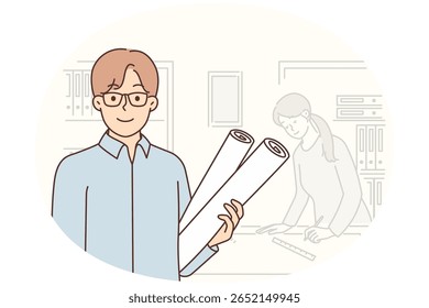 Man architect stands in office of construction company with drawings in hands to advertise architectural services. Guy and girl work in architectural bureau developing projects for new buildings